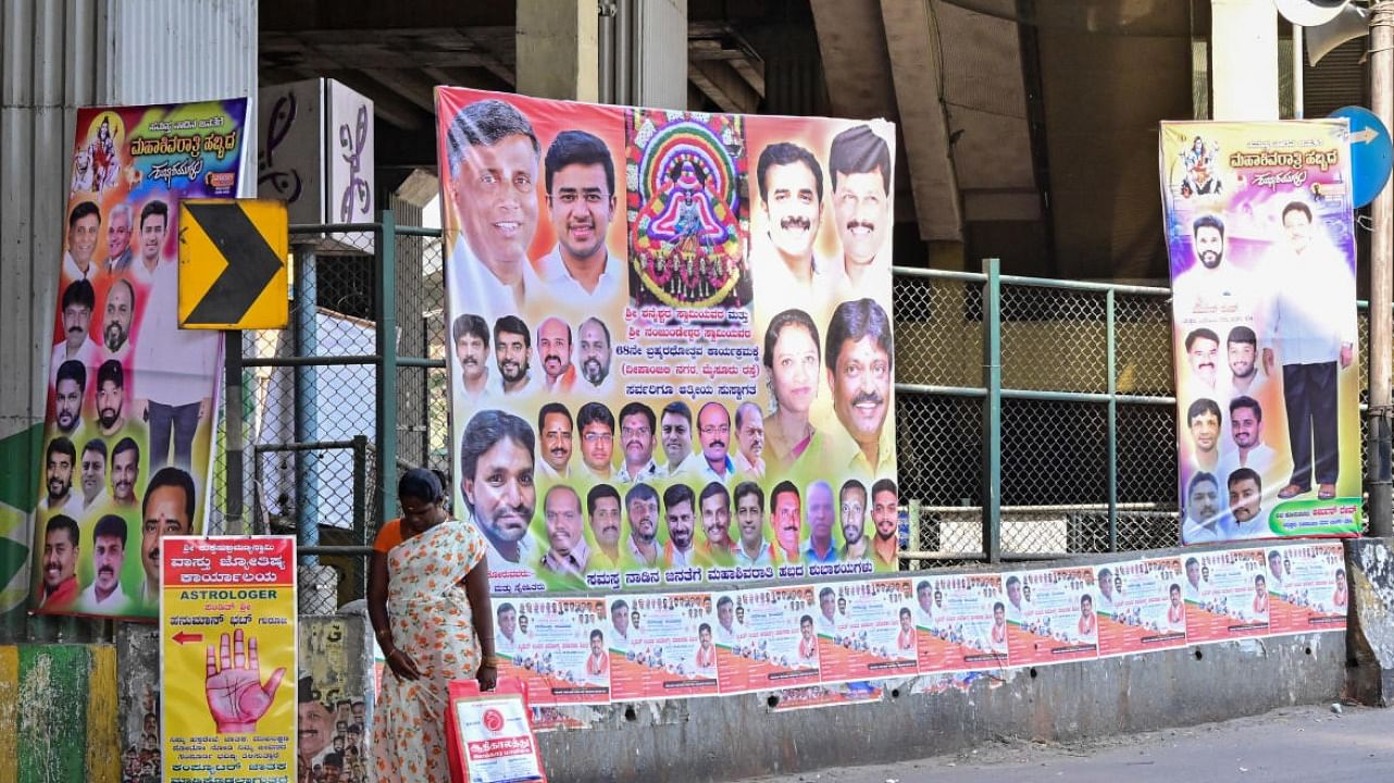 Such hoardings and flexes that dot the city roads have become an eyesore. DH FILE PHOTO 
