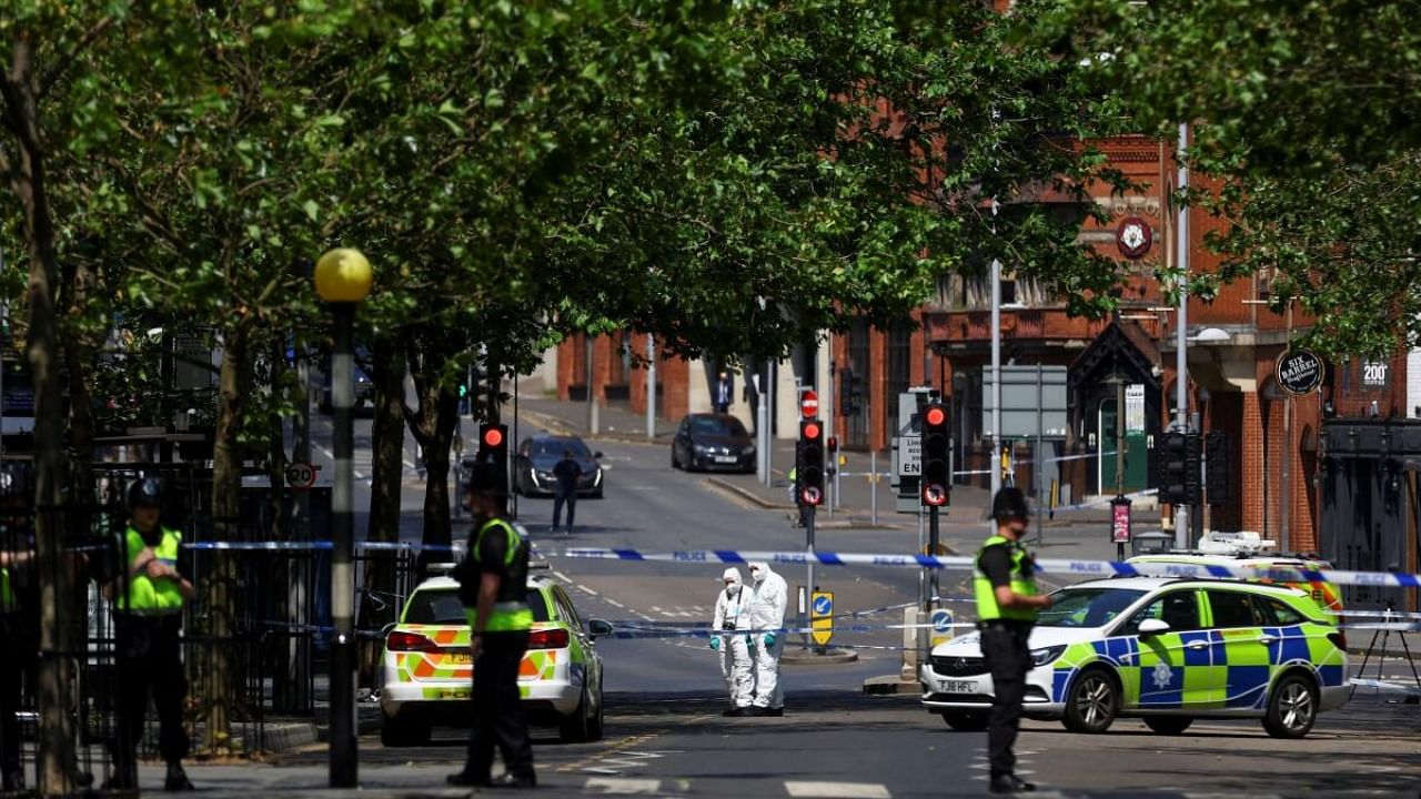 Police forensics officers work at a site cordoned with police tape, following a major incident in Nottingham city centre. Credit: Reuters Photo