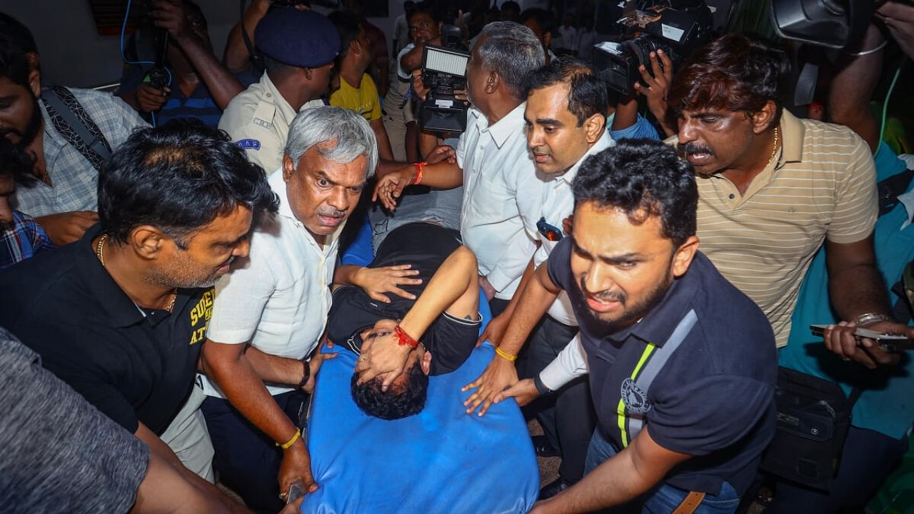 Tamil Nadu Electricity Minister V Senthil Balaji reacts in pain while being taken to a government hospital after his arrest in connection with a money laundering case. Credit: PTI Photo