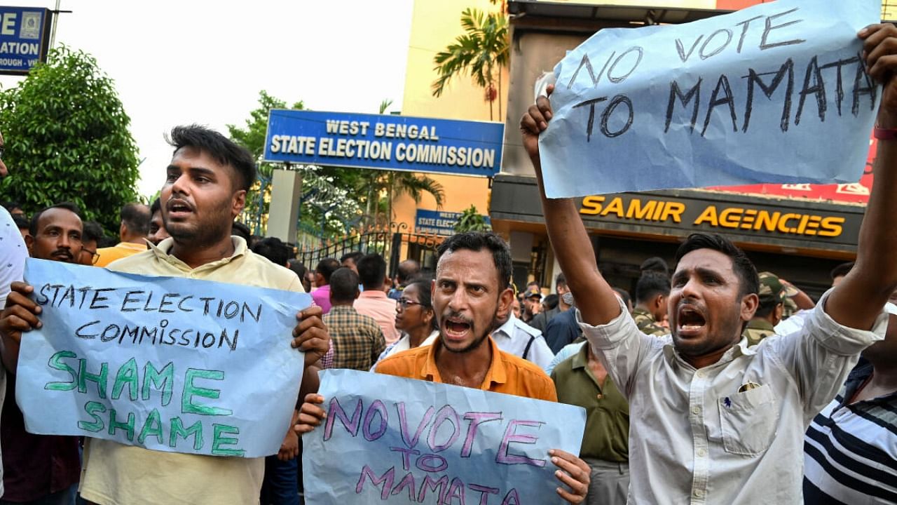 BJP workers protest stage a protest against Trinamool Congress party over obstruction by TMC in filing of nomination papers for panchayat polls by the BJP candidates. credit: PTI Photo