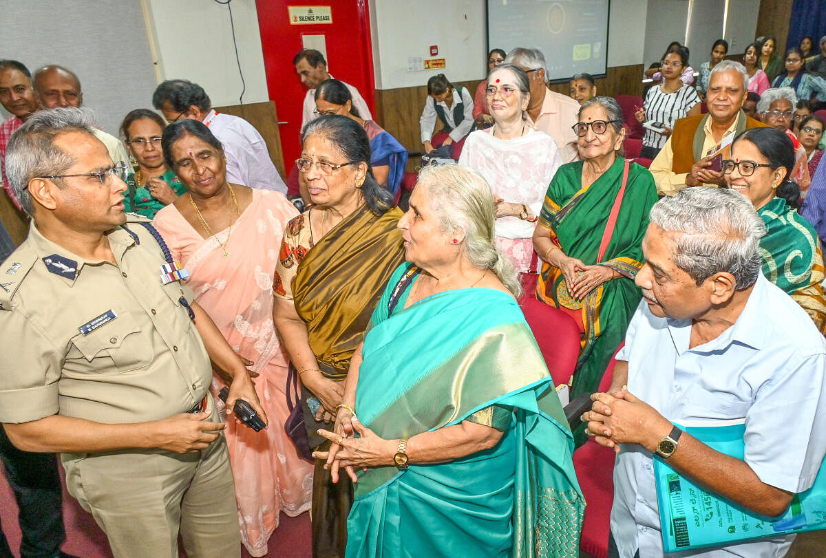 Bengaluru Police Commissioner B Dayananda interacts with senior citizens at his office on Infantry Road on Thursday. Credit: DH Photo/Prashanth H G