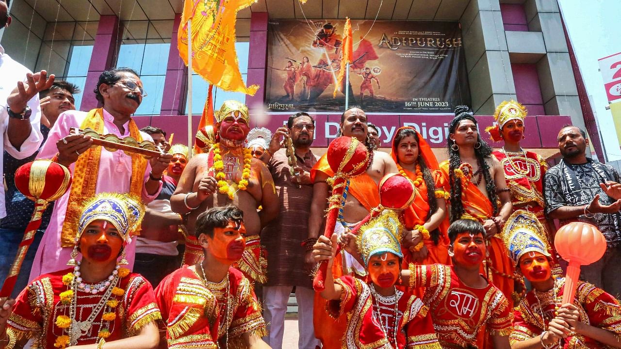 BJP workers with artists dressed as Lord Ram, Laxman, Hanuman and Goddess Sita arrive to watch the movie 'Adipurush' on the first day of its release, in Bhopal. Credit: PTI Photo