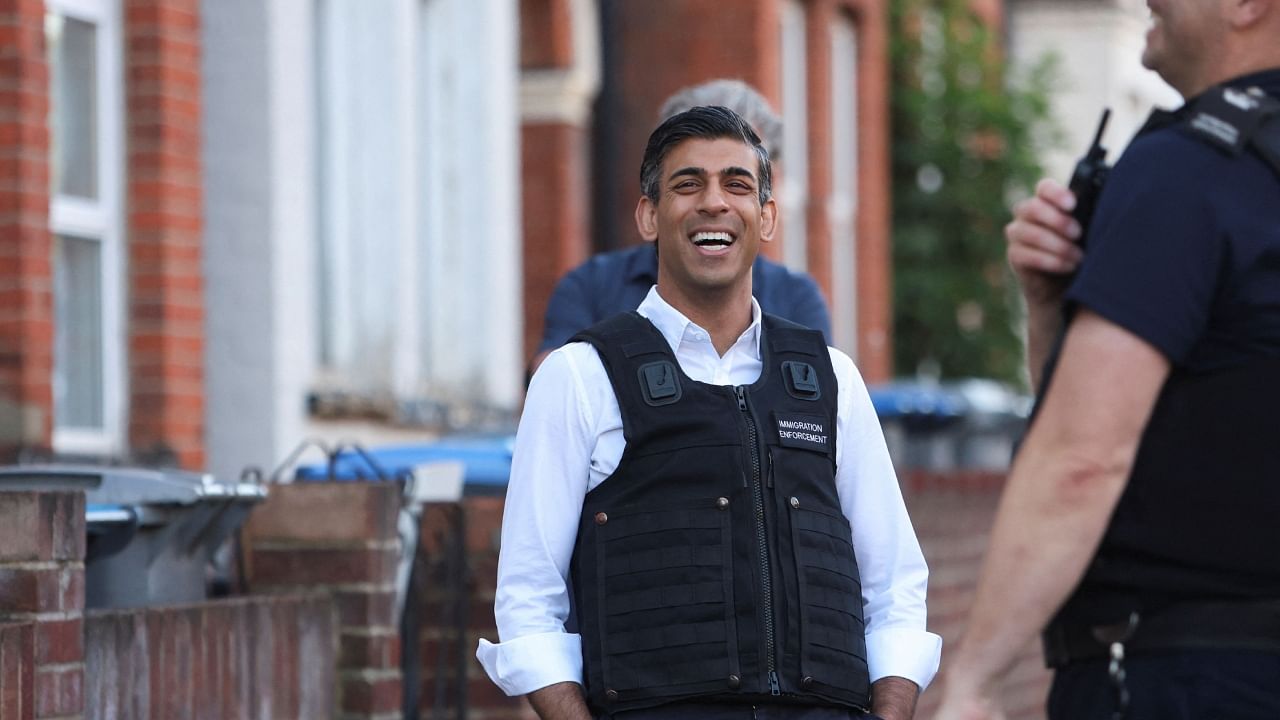 British Prime Minister Rishi Sunak watches an immigration raid in northwest London, Britain, June 15, 2023. Credit: Reuters Photo