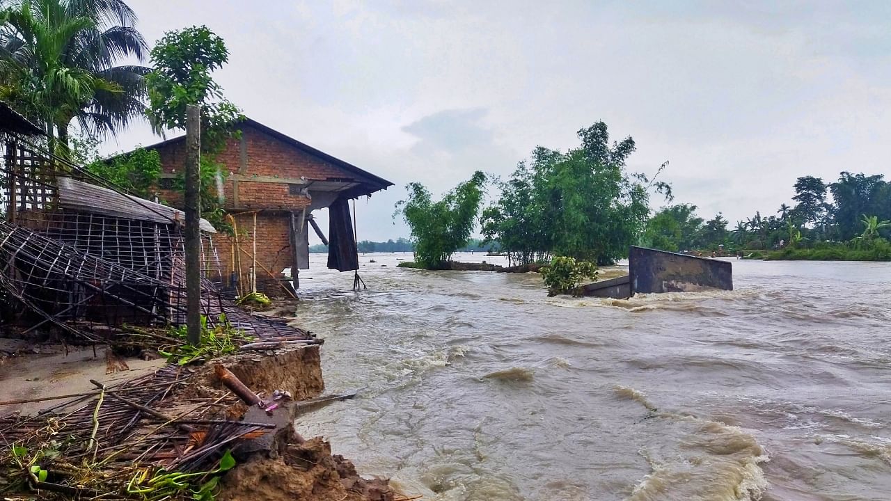 Several houses are damaged as the flood water makes its way in the aftermath of the Cyclone Biparjoy, in Kutch district, Friday, June 16, 2023. Credit: PTI Photo