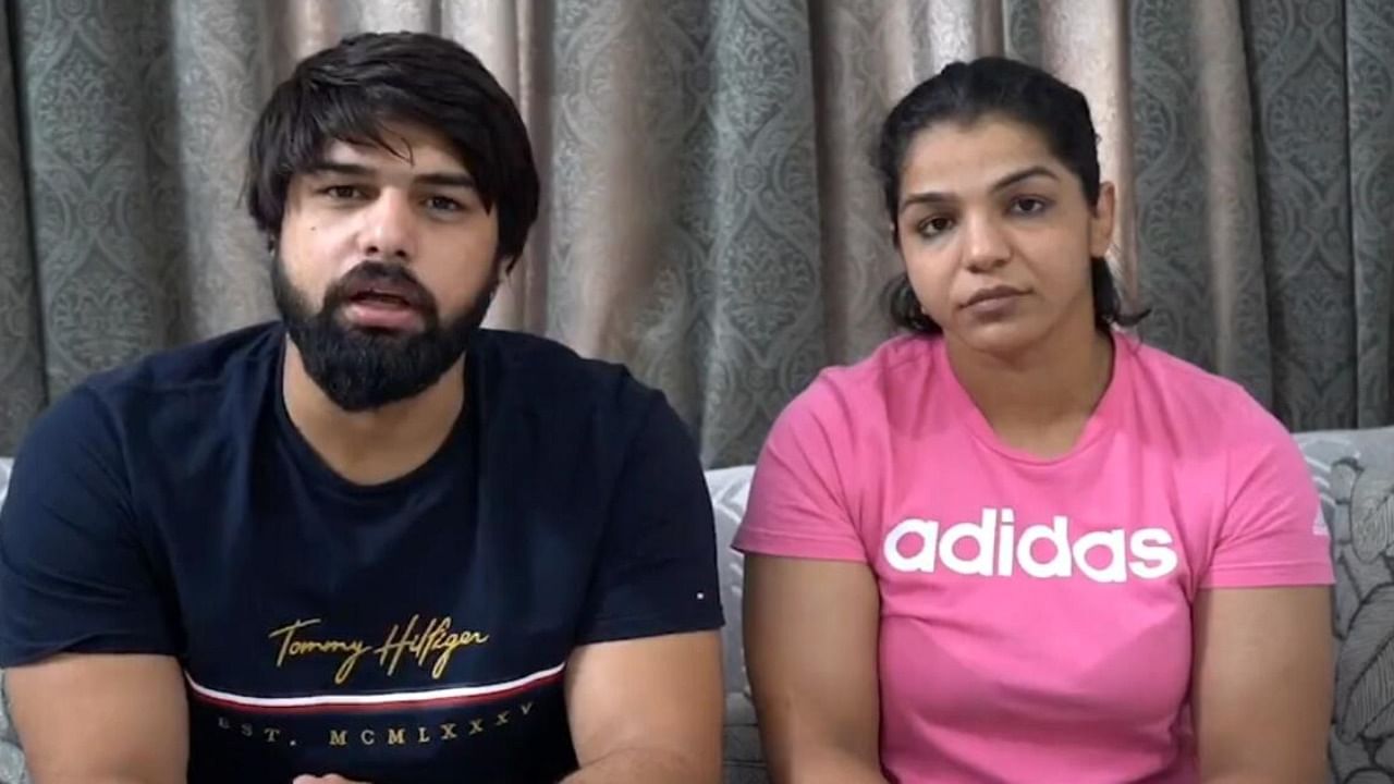 Wrestlers Satyawart Kadian and Sakshi Malik speak during a video message. Credit: IANS Photo
