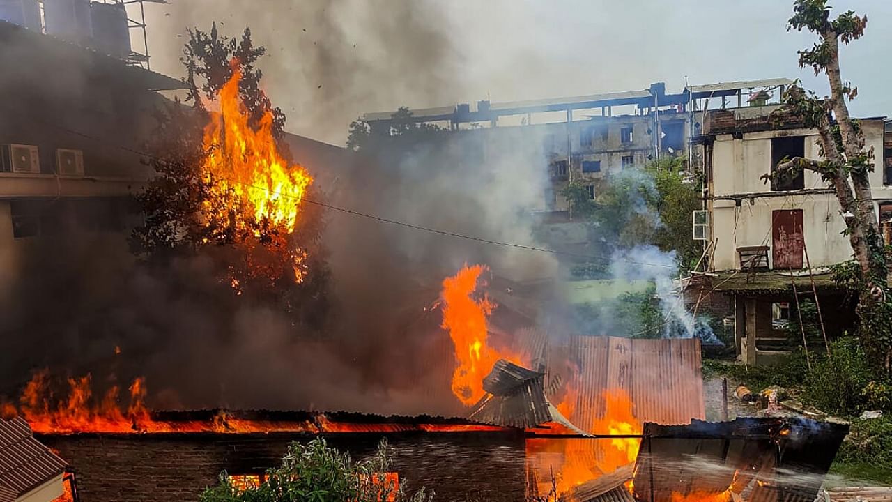  Flames and smoke billows out after an old warehouse owned by a retired bureaucrat set ablaze amid violence in Manipur. Credit: PTI Photo