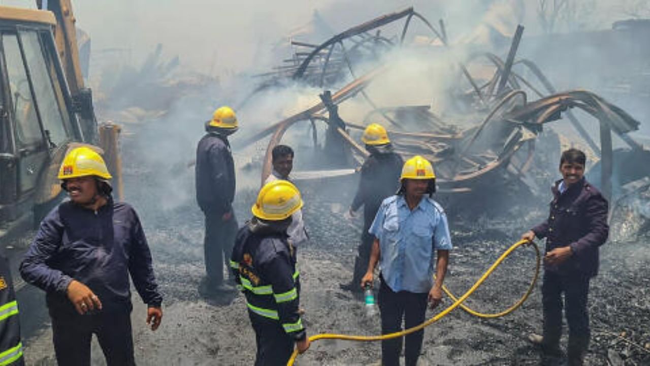 Firefighters attempt to douse a fire that broke out in the Kondhwa Road area, in Pune. Credit: PTI Photo