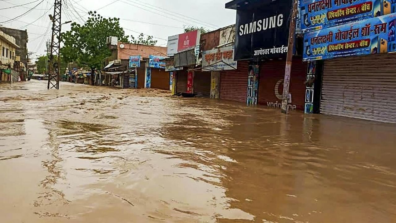 View of a flooded street due to heavy rainfall caused by cyclone Biparjoy, in Sanchore, Sunday, June 18, 2023. Credit: PTI Photo