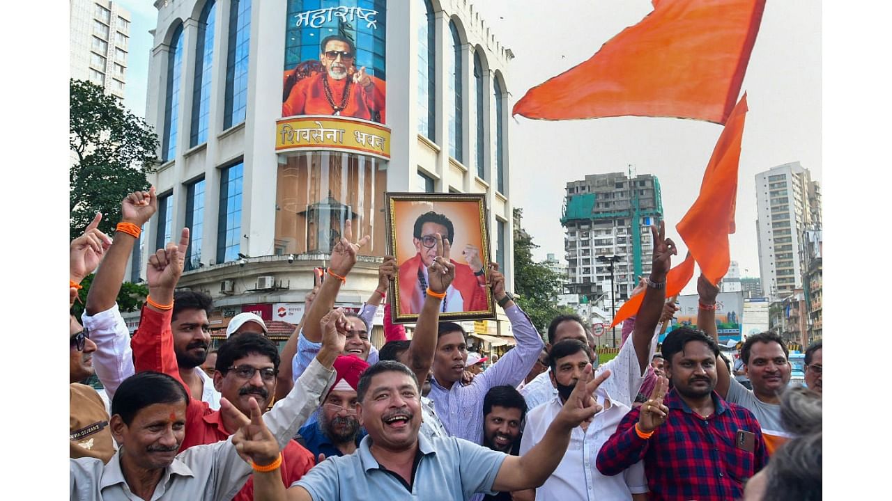 Shiv Sena party activists celebrate after the High Court directed the BMC to allow the Shiv Sena faction led by Uddhav Thackeray to hold a Dussehra gathering at Shivaji Park, in Mumbai, Friday, Sept. 23, 2022. Credit: PTI Photo