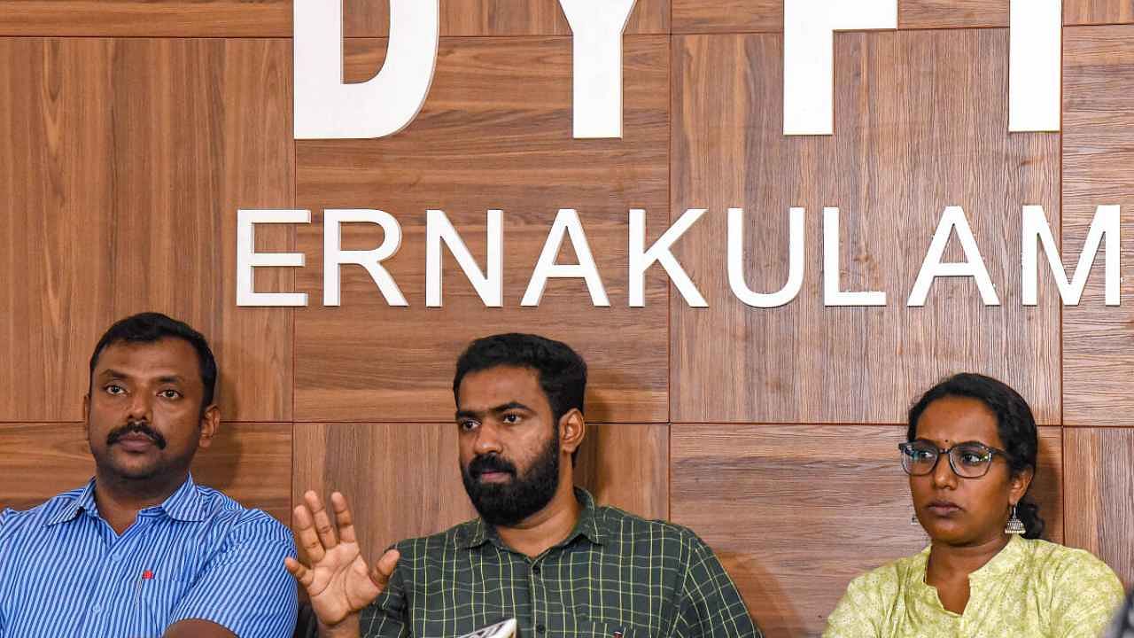 Kochi: DYFI State Secretary VK Sanoj (C) addresses a press conference over the fake certificate fraud case, at the DYFI office in Kochi, Tuesday, June 20, 2023. A.R Ranjith (DYFI District Secretary (L) with DYFI State Secretariat Member Meenu Sukumaran (R) are also present. Credit: PTI Photo