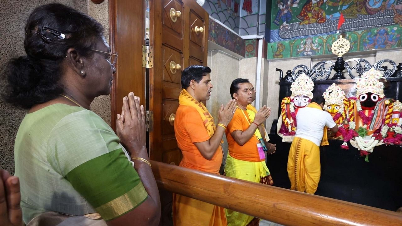 President Droupadi Murmu offers prayers at Lord Jagannath Mandir on the occasion of Rath Yatra, at Hauz Khas in New Delhi. Credit: IANS/Twitter