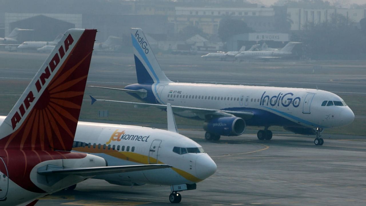 An IndiGo Airlines Airbust A320 aircraft and JetKonnect Boeing 737 aircraft taxi past an Air India Airbus A321 aircraft at Mumbai's Chhatrapathi Shivaji International Airport. Credit: Reuters File Photo