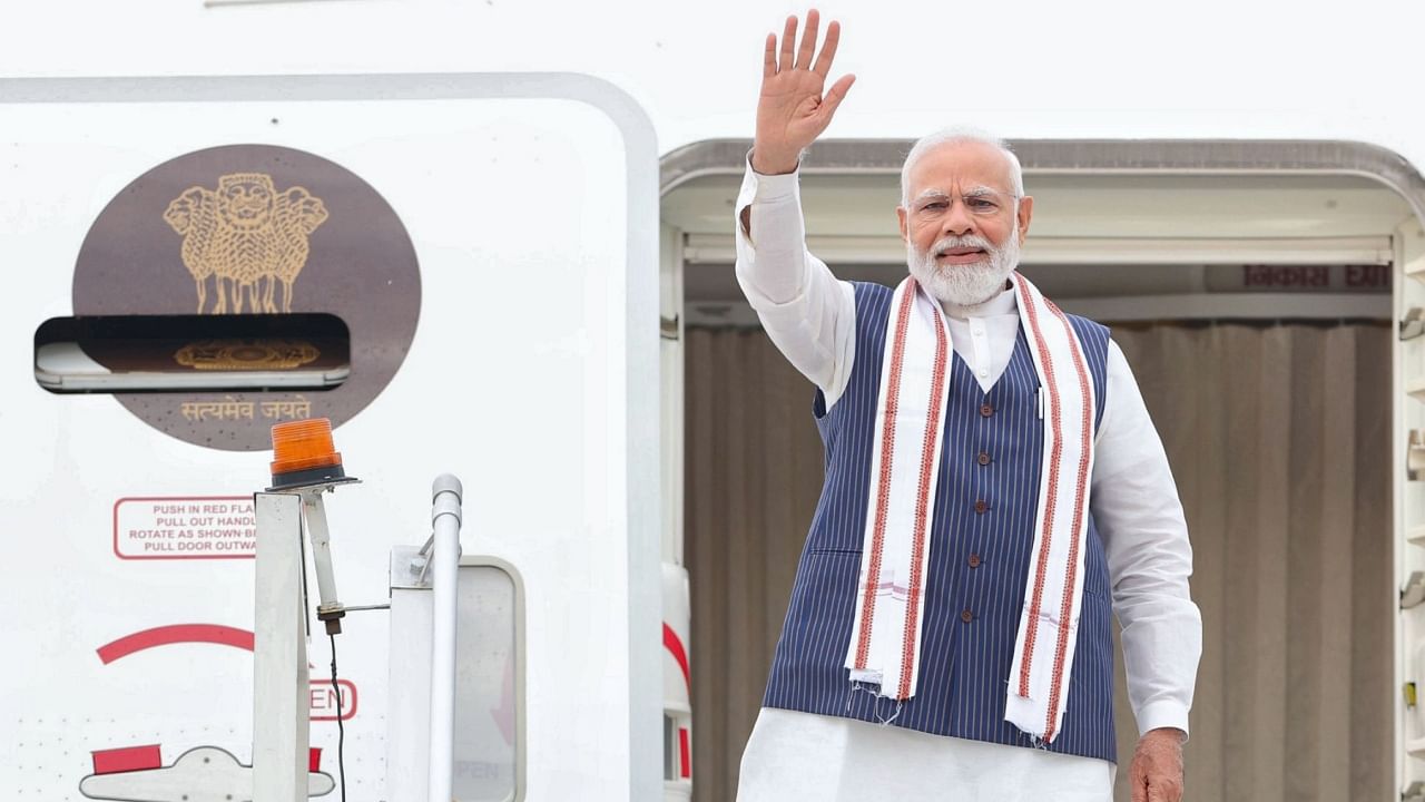 Prime Minister Narendra Modi waves while leaving for his visit to US. Credit: PTI Photo