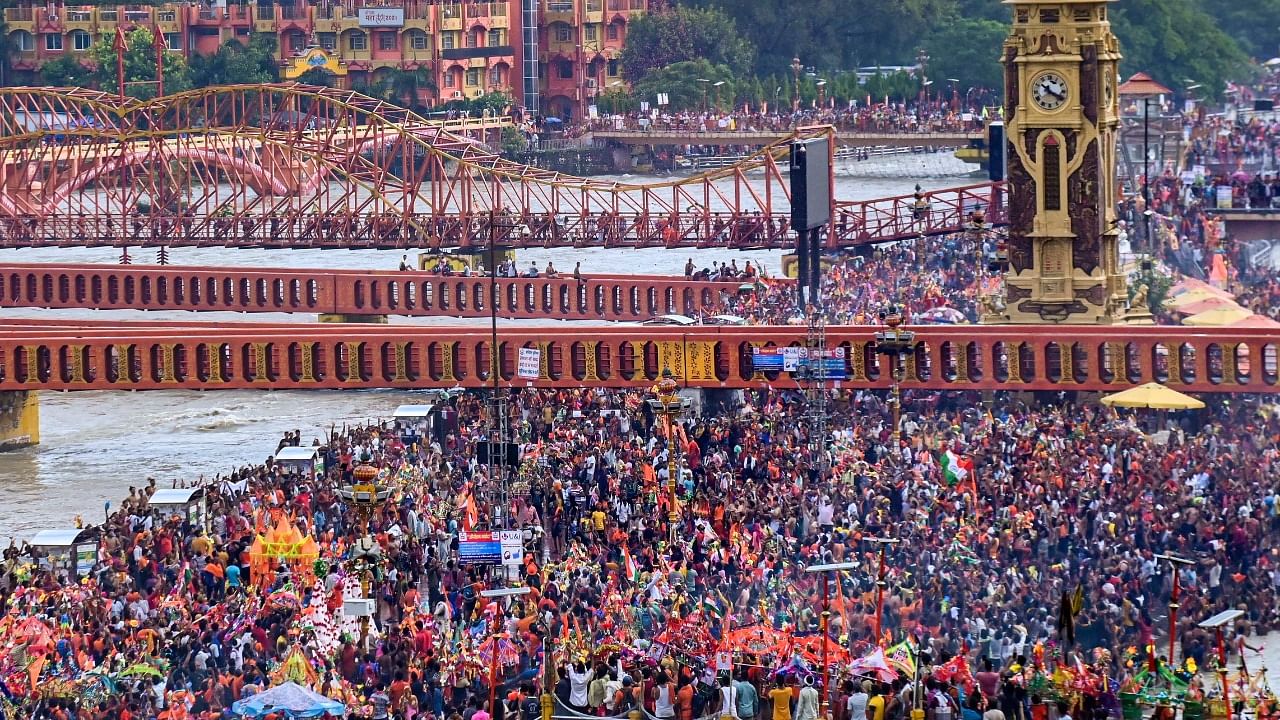 <div class="paragraphs"><p>A helicopter is used to shower flower petals on Kanwariyas during the 'Kanwar Yatra' at Har Ki Pauri Ghat in Haridwar in 2022. </p></div>