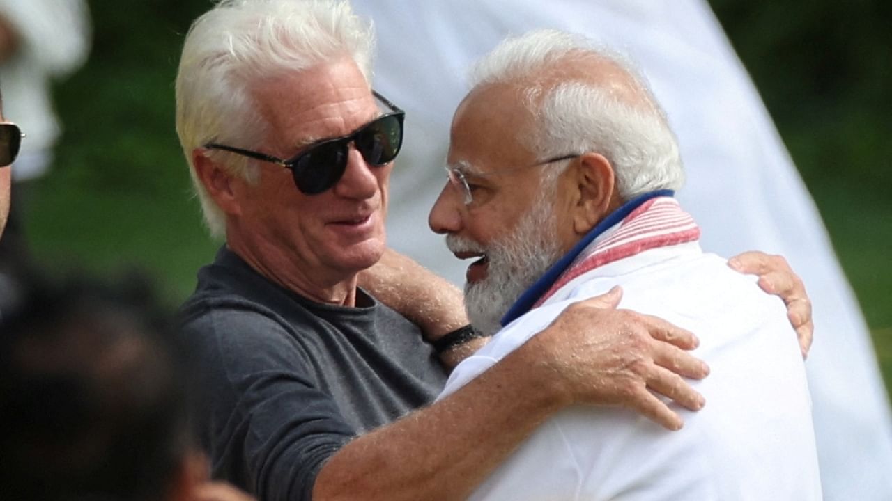 Prime Minister Narendra Modi embraces actor Richard Gere as they attend the 9th International Day of Yoga event on the north lawn at United Nations headquarters in New York City, New York, US, June 21, 2023. Credit: Reuters Photo