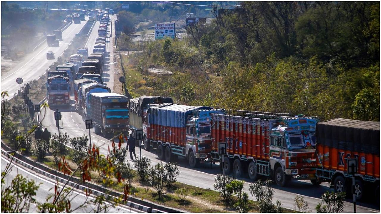Jammu: Stranded trucks wait for the opening of the Jammu-Srinagar national highway, in Nagrota on the outskirts of Jammu, Monday, Jan 28, 2019. Credit: PTI Photo