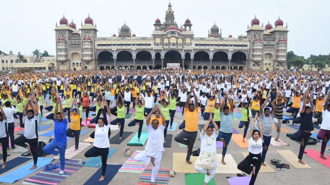 People perform Yoga on International Yoga Day at Mysuru Palace premises. Credit: Special Arrangement 