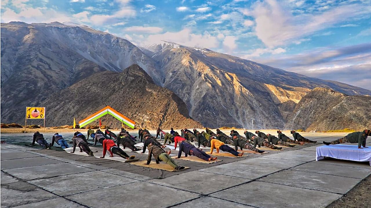  Indian Army personnel perform yoga on the occasion of International Day of Yoga. Credit: PTI Photo