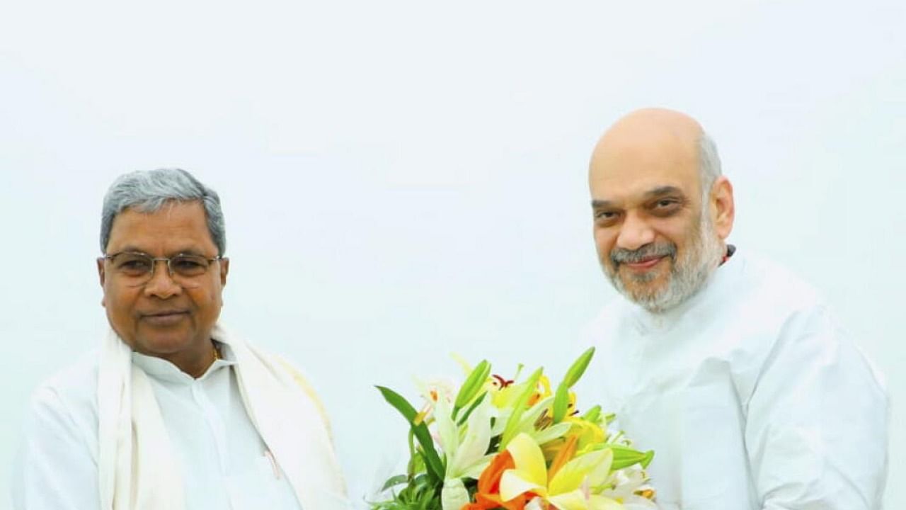 Siddaramaiah meets Shah. PTI Photo