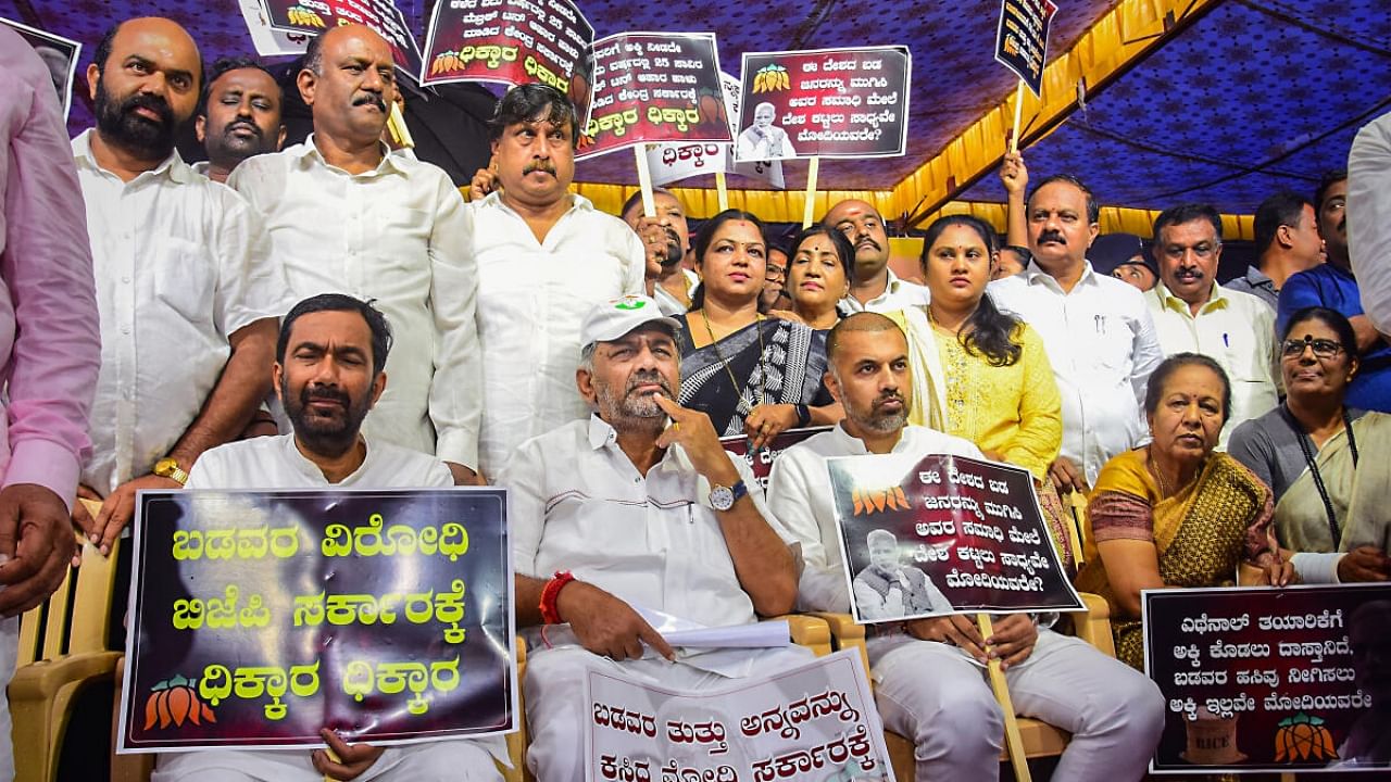 Karnataka Deputy Chief Minister and Congress state President DK Shivakumar with party leaders and ministers during a protest against the BJP-led central government for allegedly denying rice for the state government's Anna Bhagya scheme. Credit: PTI Photo