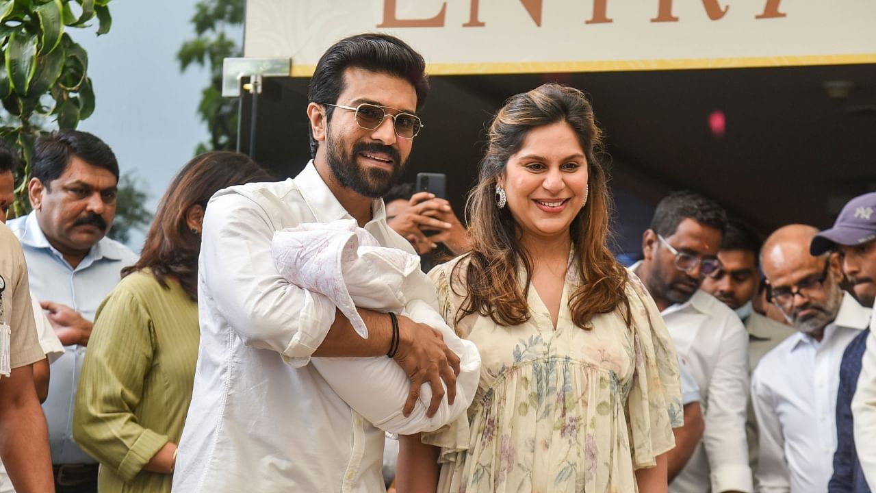 Ram Charan and his wife Upasana with their new-born baby as the leave the Apollo Hospital, in Hyderabad. Credit: PTI Photo