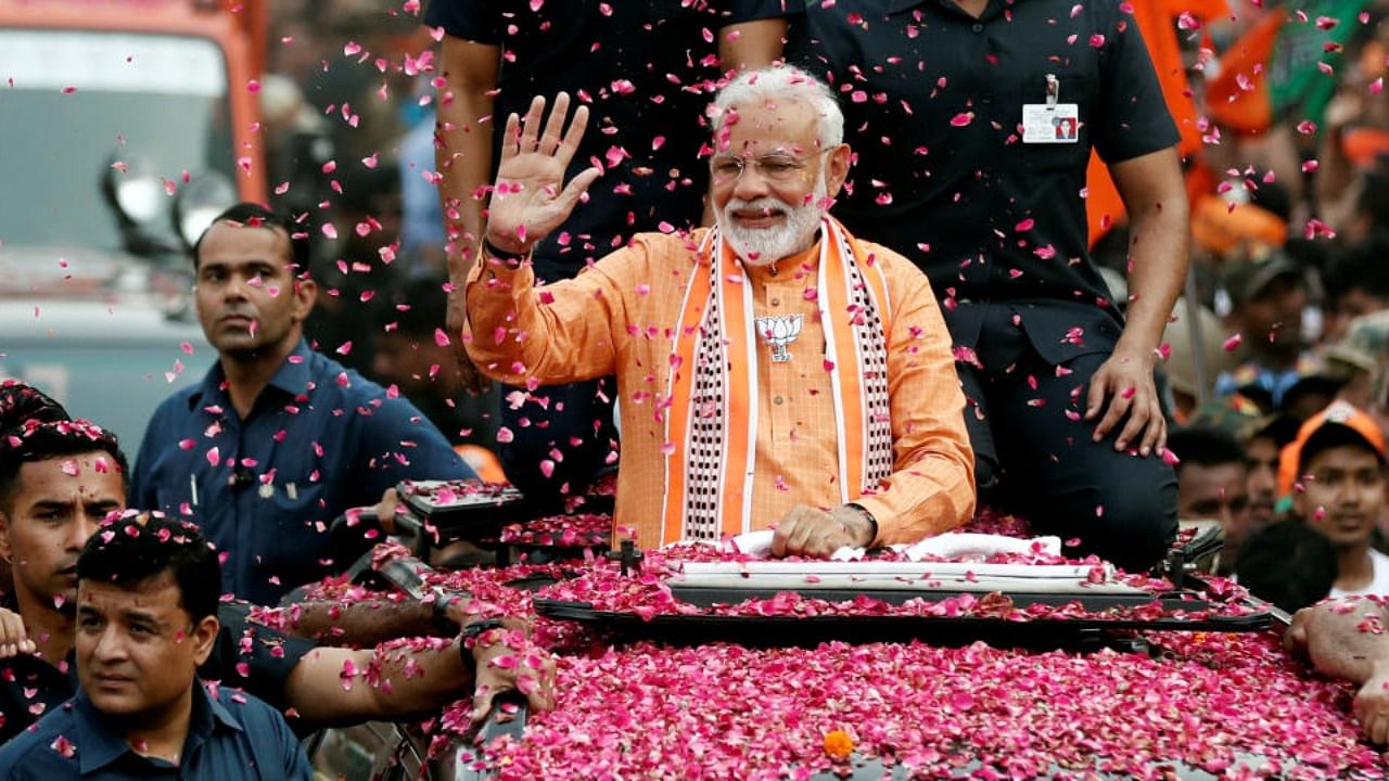 File photo of PM Modi during a roadshow in Varanasi. Credit: Reuters Photo