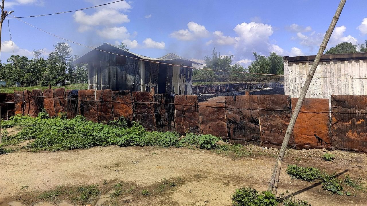 Burnt remains of the godown of Manipur minister after it was set ablaze by a mob during the continuing ethnic unrest between Kuki and Meitei communities. Credit: PTI Photo