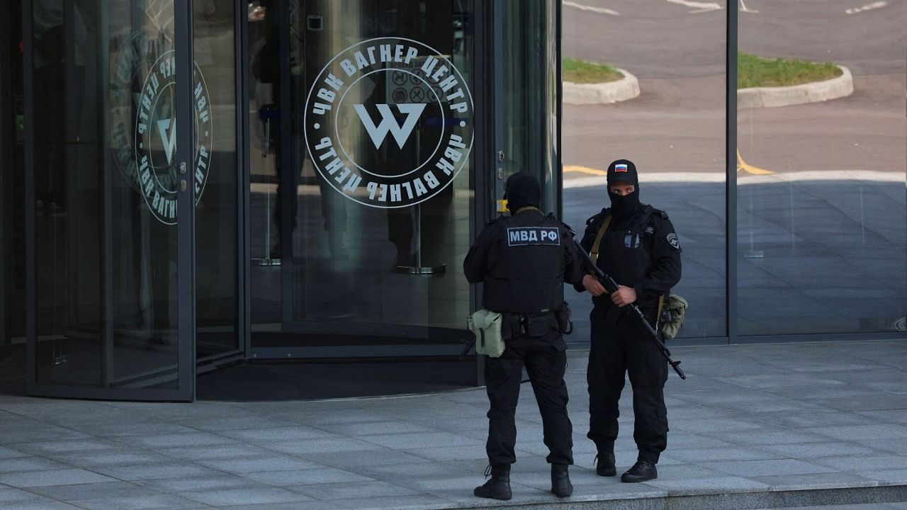 Russian law enforcement officers stand guard outside PMC Wagner Centre in Saint Petersburg. Credit: Reuters Photo
