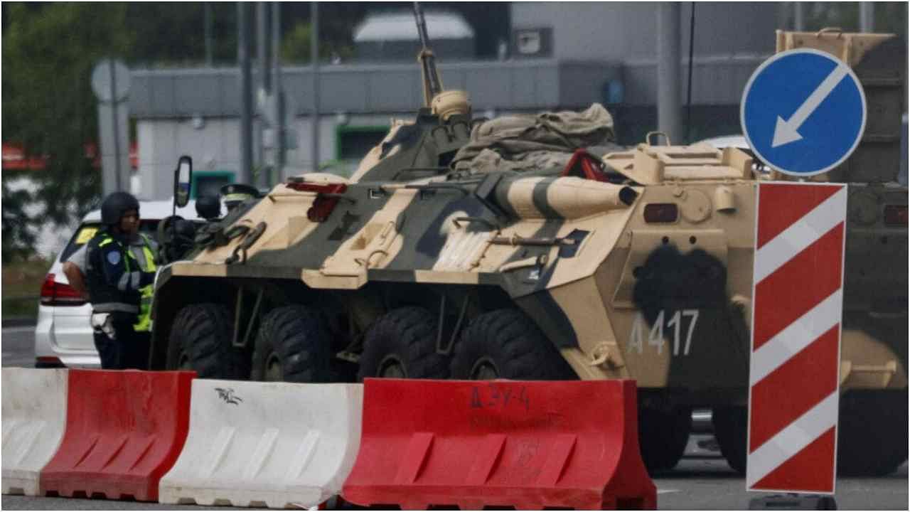 A traffic police officer checks a car next to an armoured personnel carrier (APC) in Moscow, Russia June 24, 2023. Credit: Reuters Photo