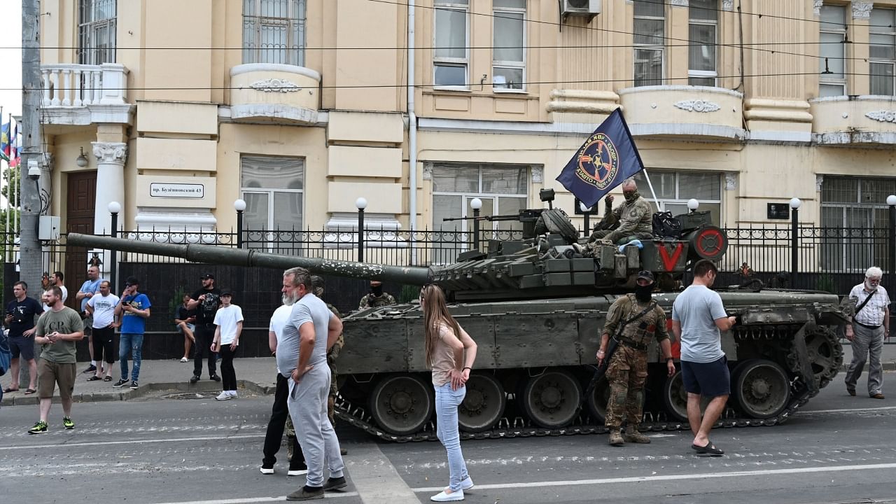 People gather in a street as fighters of Wagner private mercenary group are deployed near the headquarters of the Southern Military District in the city of Rostov-on-Don, Russia, June 24, 2023. Credit: Reuters Photo