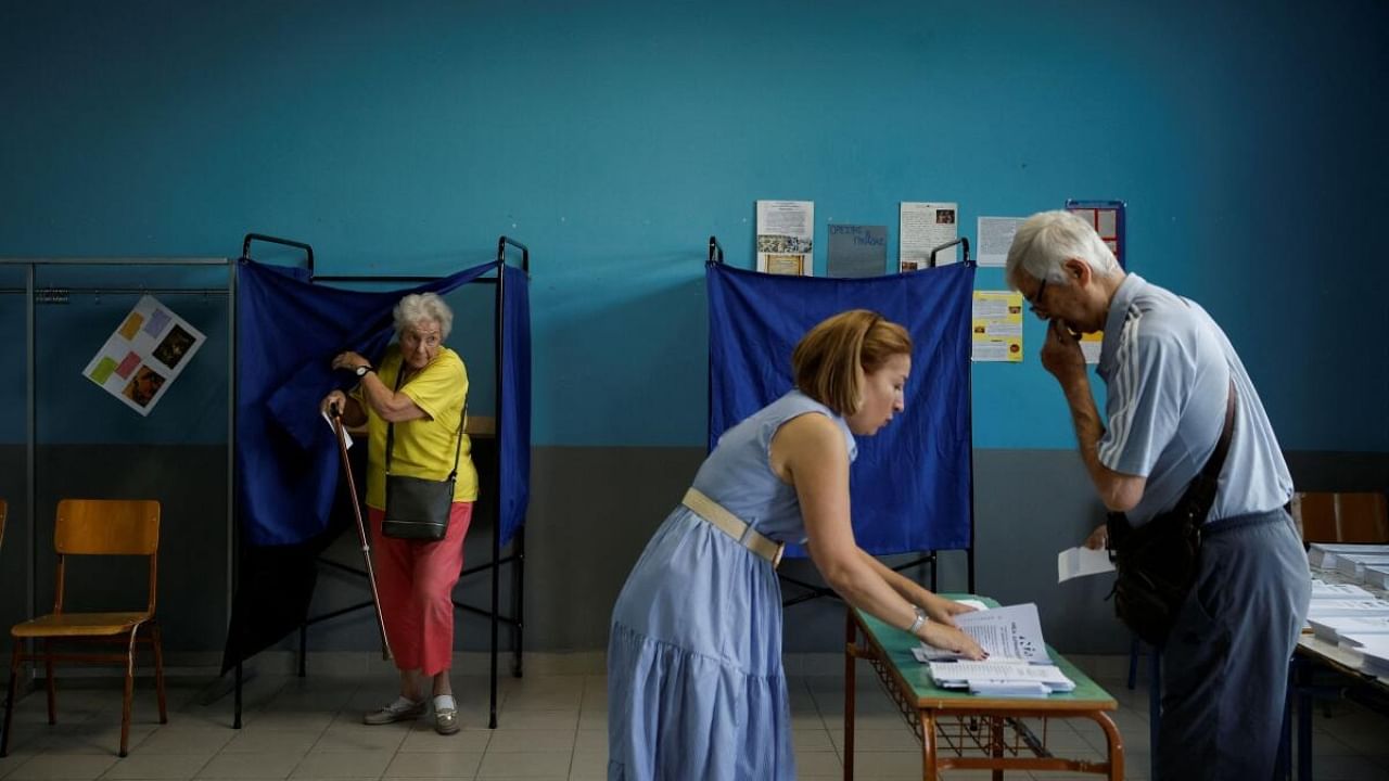 People cast their votes at a polling station, during the general election, in Athens, Greece. Credit: Reuters Photo