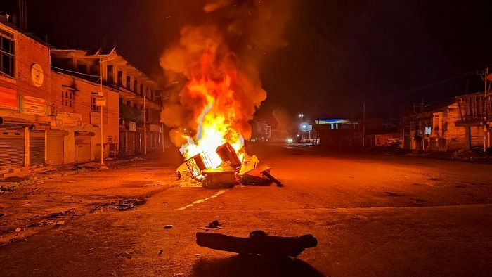 Tyres and construction materials set on fire by miscreants amid ongoing ethnic violence in Manipur, in Imphal East district, Friday, June 16, 2023. Credit: PTI Photo 