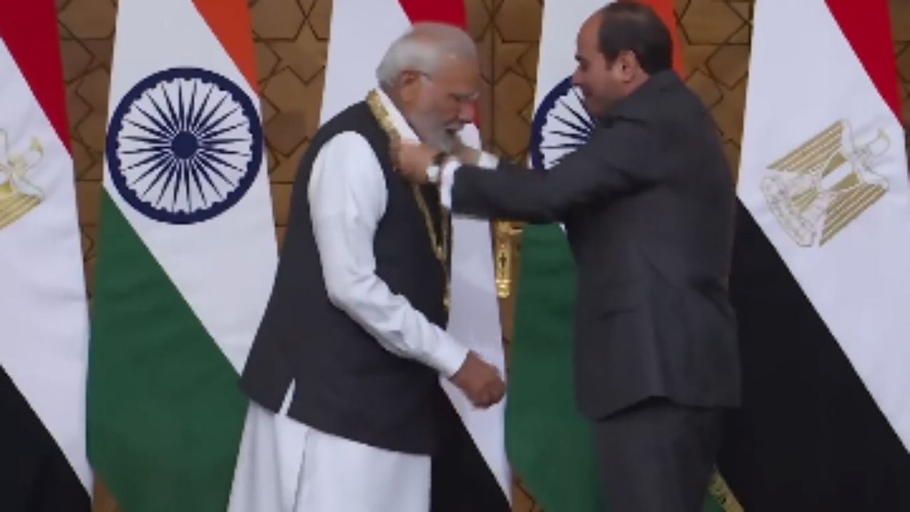 Eqyptian President Abdel Fattah El-Sisi confers Prime Minister Narendra Modi with 'Order of the Nile' award. credit: PTI Photo