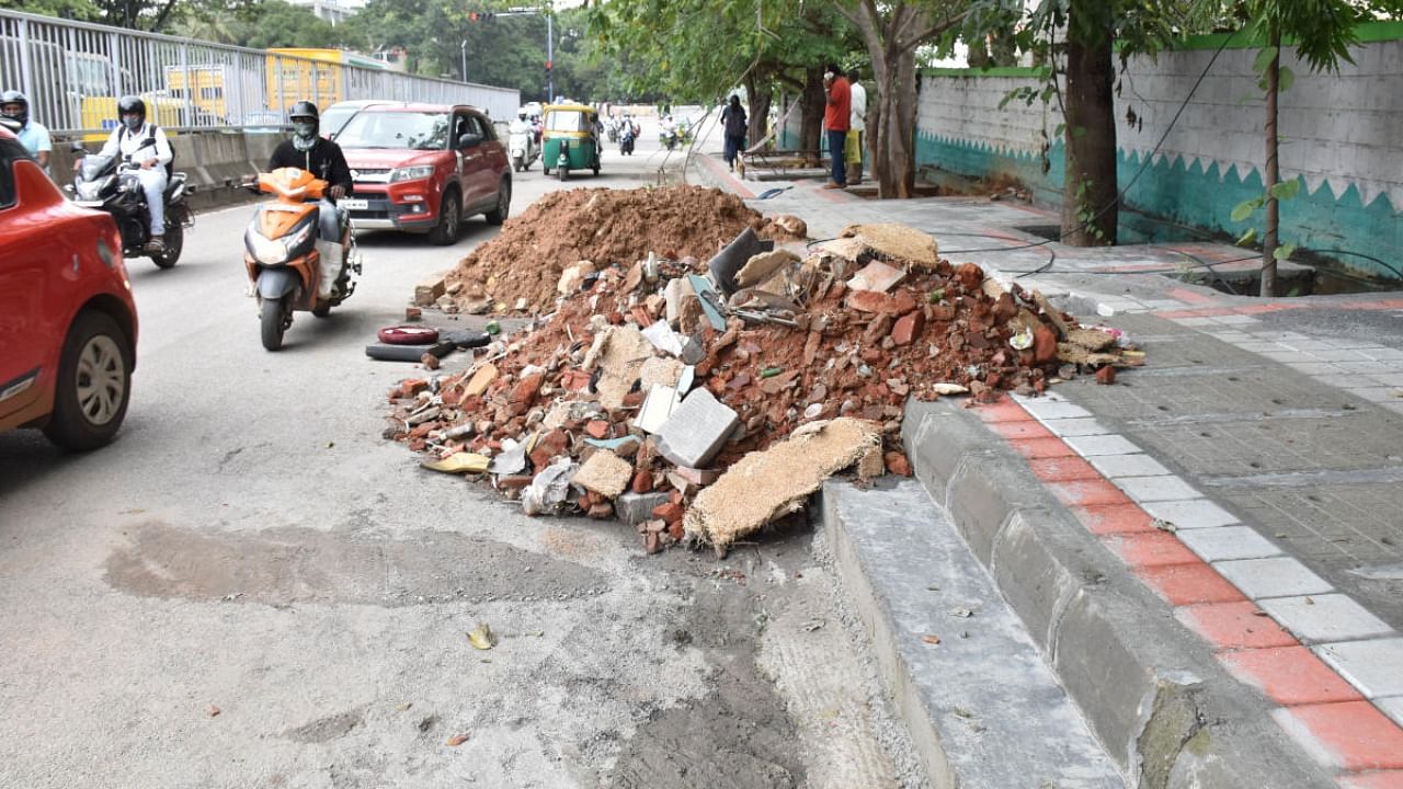 Besides causing fatal accidents, such piles of uncleared construction debris are a nuisance and an eyesore. Credit: DH File Photo