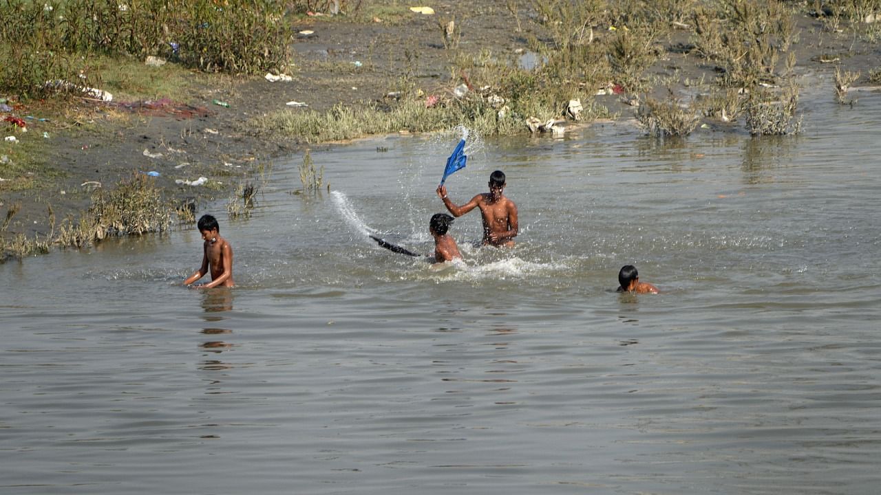 Children cool off on the banks of river Yamuna. Credit: PTI File Photo