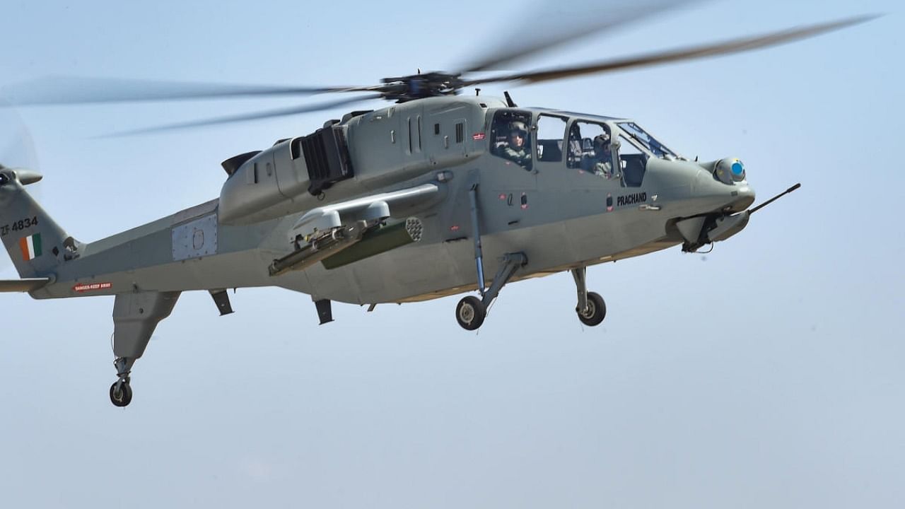 Jodhpur: Union Defence Minister Rajnath Singh during a sortie in the newly inducted indigenously built Light Combat Helicopter (LCH) "Prachand", in Jodhpur, Monday, Oct. 3, 2022. Credit: PTI Photo
