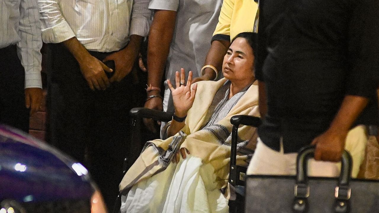West Bengal Chief Minister Mamata Banerjee in a wheelchair leaves after being treated at SSKM hospital, in Kolkata. Credit: PTI Photo