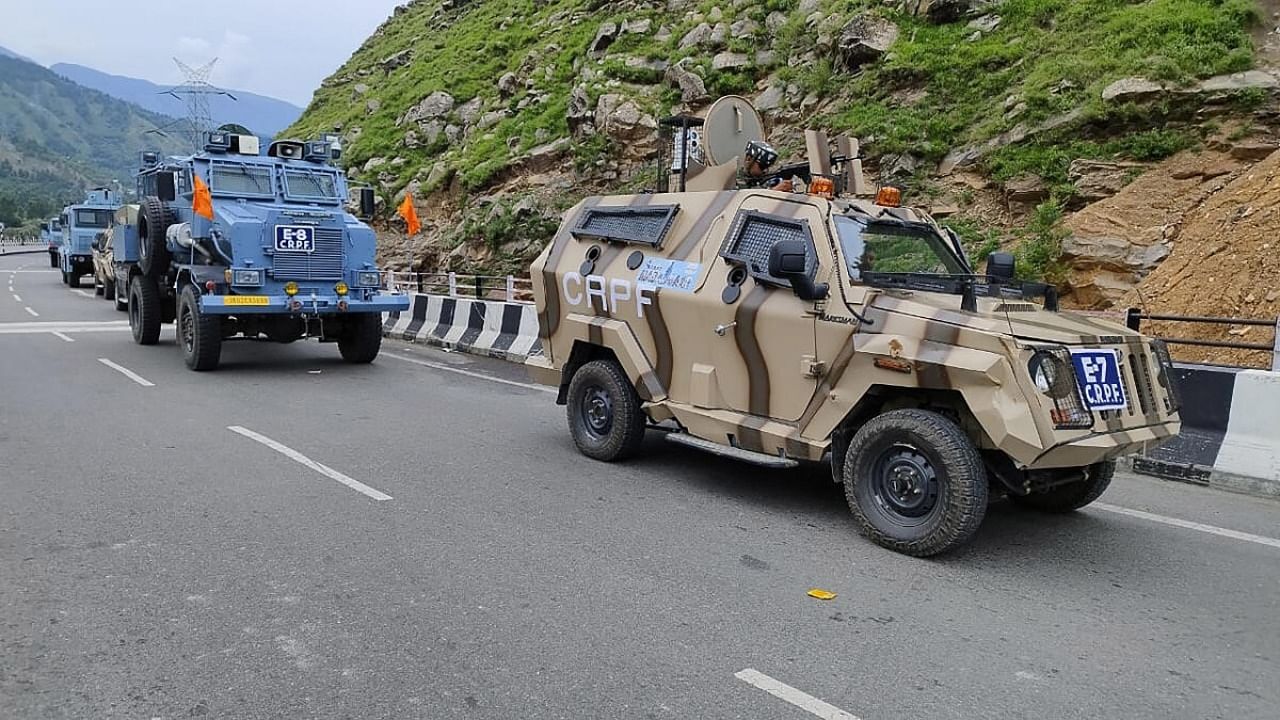 CRPF personnel patrol Jammu & Kashmir National Highway as first batch of pilgrims leaves for Amarnath Yatra 2023, on the outskirts of Jammu, Friday, June 30, 2023. Credit: PTI Photo