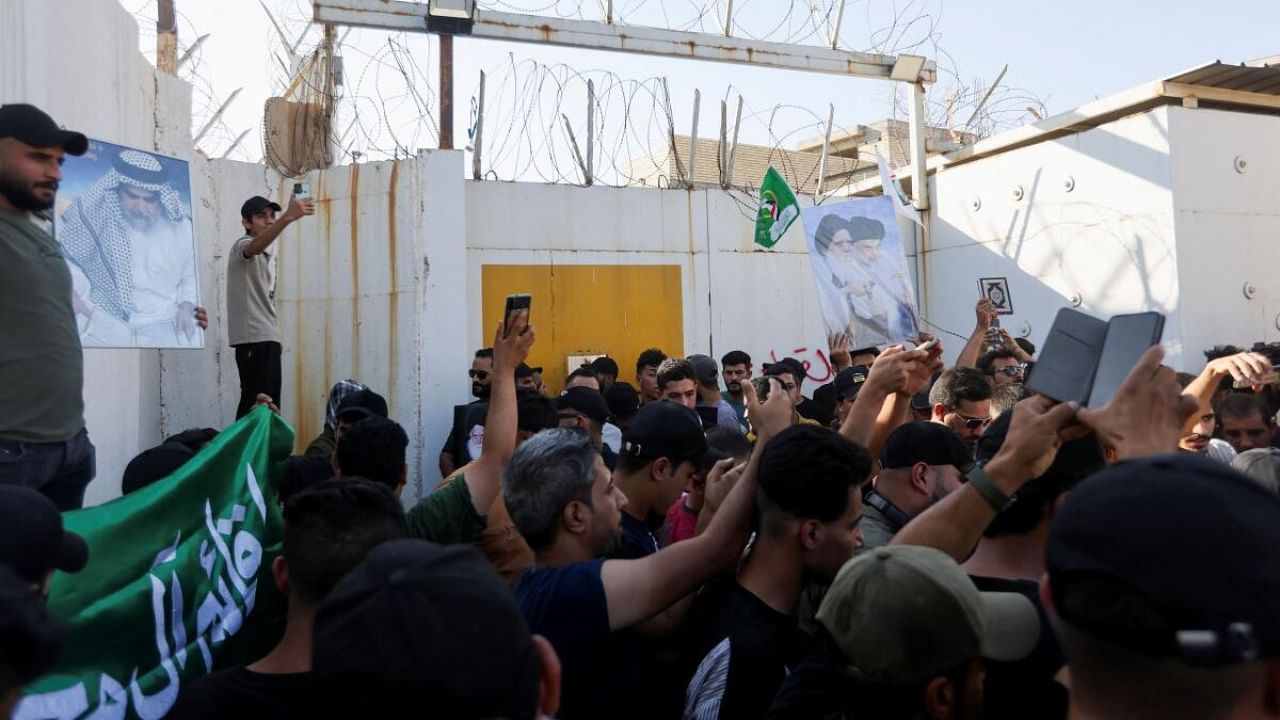 Protesters gather at the entrance to the Swedish embassy in Baghdad a day after a man tore up and burned a copy of the Quran outside a mosque in the Swedish capital Stockholm. Credit: Reuters Photo