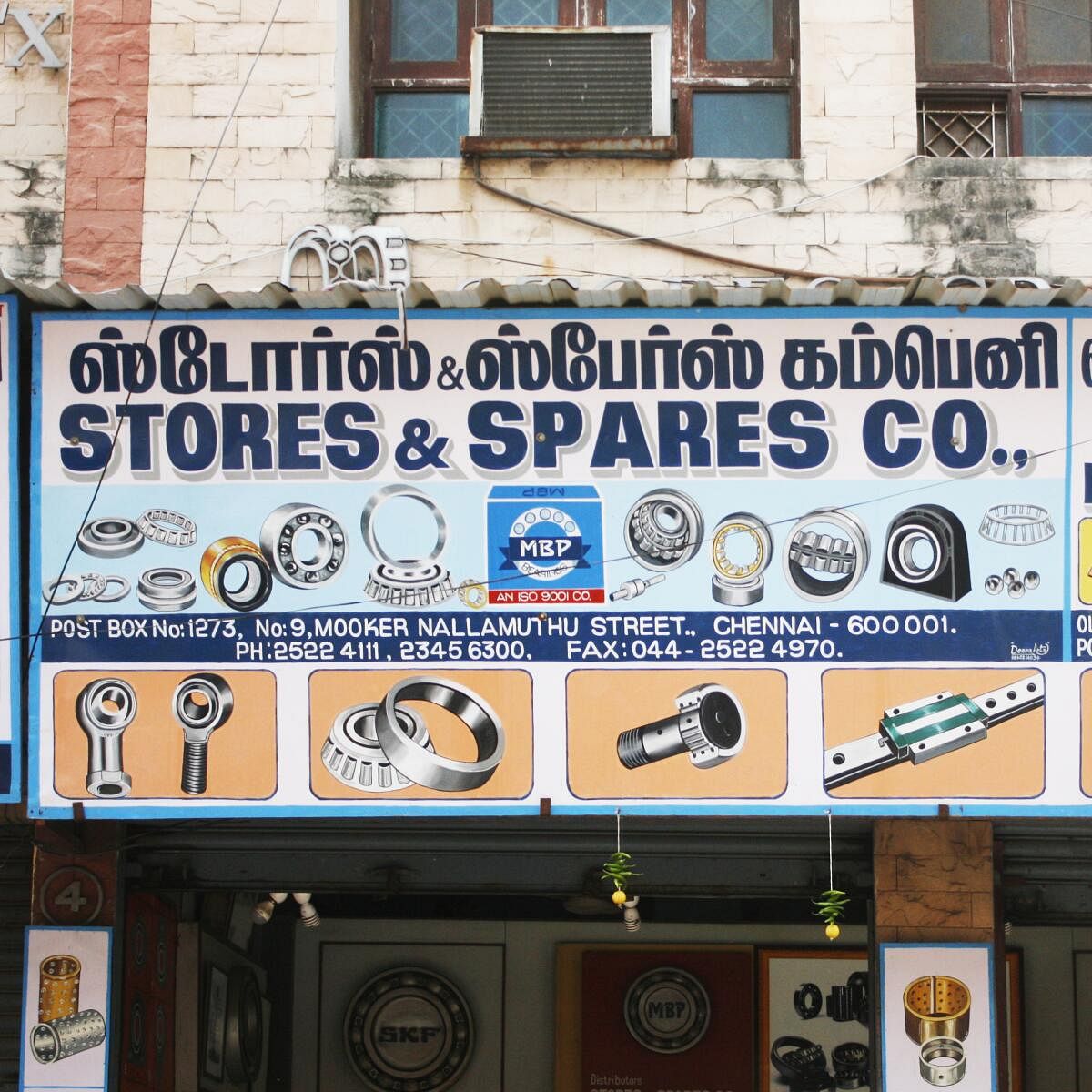 A hardware shop in Chennai supplements its multilingual sign with the illustration of the wares it sells.