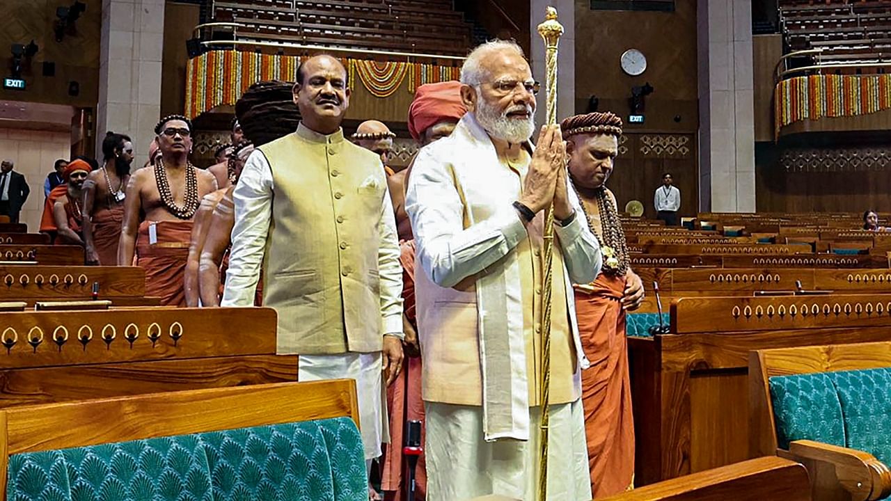 Prime Minister Narendra Modi carries the 'Sengol' in a procession before installing it in the Lok Sabha chamber at the inauguration of the new Parliament building. Credit: PTI File Photo