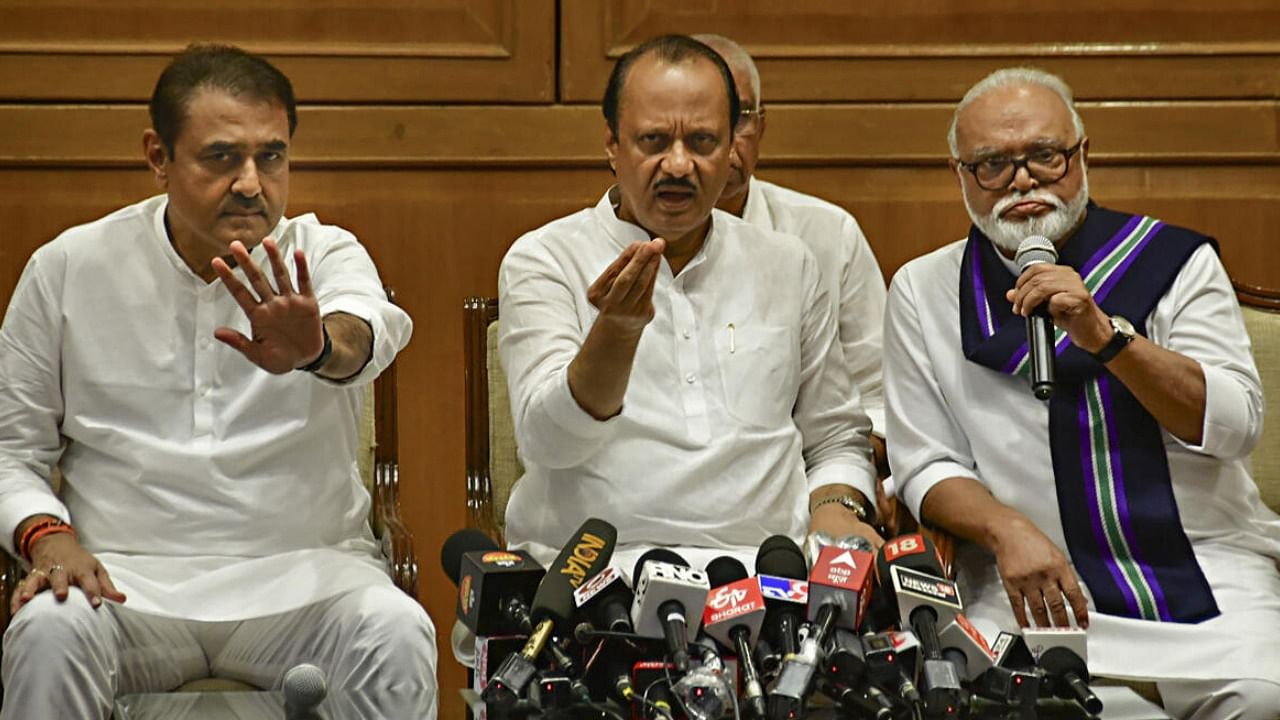 Newly sworn-in Maharashtra Deputy CM Ajit Pawar with NCP leaders Chhagan Bhujbal and Praful Patel during a press conference, in Mumbai. Credit: PTI Photo