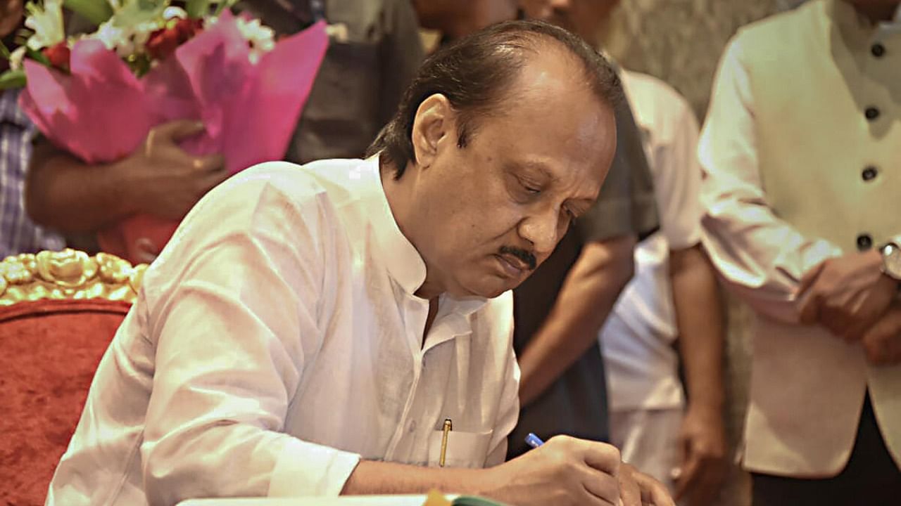 Nationalist Congress Party (NCP) leader Ajit Pawar signs documents after taking oath as Maharashtra Deputy Chief Minister, during a ceremony at Raj Bhavan, in Mumbai, Sunday, July 2, 2023. Credit: PTI Photo