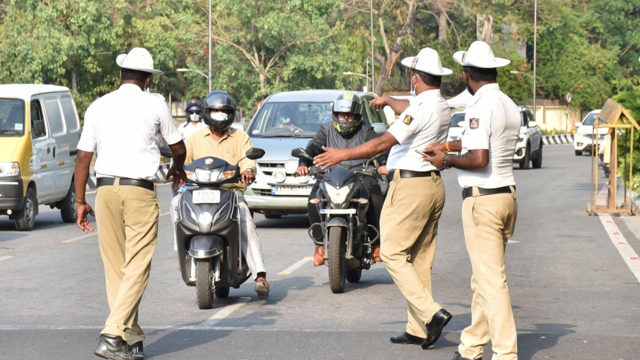 Traffic police officers insisted that the drive would cover only a handful of violations: wrong-side driving, footpath riding/parking and jumping the signal. Credit: DH Photo
