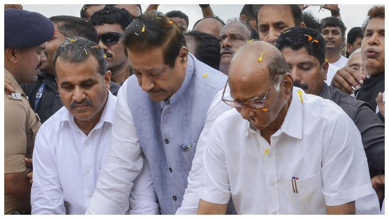 NCP Chief Sharad Pawar with Congress leader Prithviraj Chavan pays tribute to former Maharashtra chief minister Yashwantrao Chavan, in Karad, Monday, July 3, 2023. Credit: PTI Photo