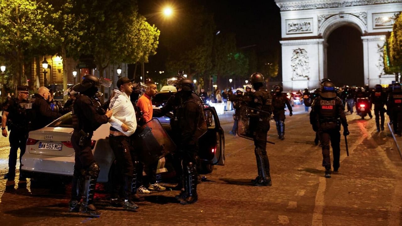 Police detain young people during the fifth night of protests following the death of Nahel, a 17-year-old teenager killed by a French police. Credit: Reuters Photo