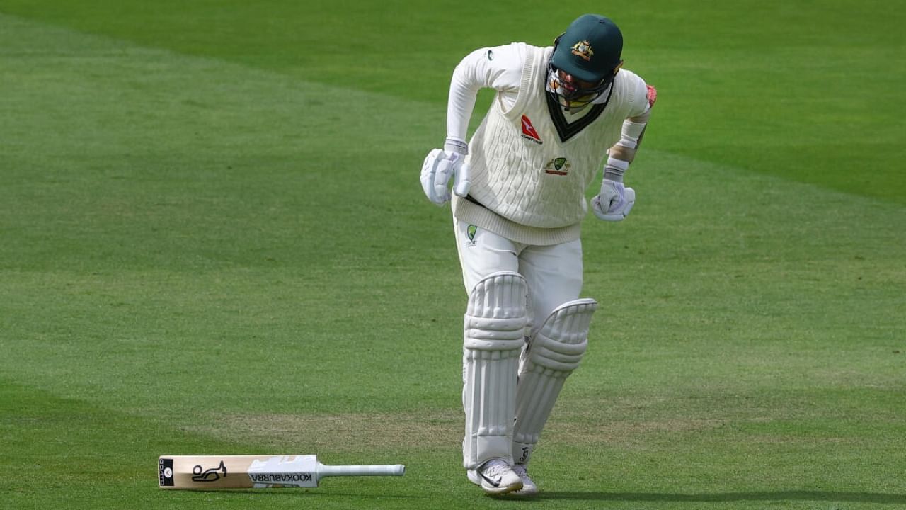 Australia's Nathan Lyon struggles with his injury as he tries to run. Credit: Reuters Photo