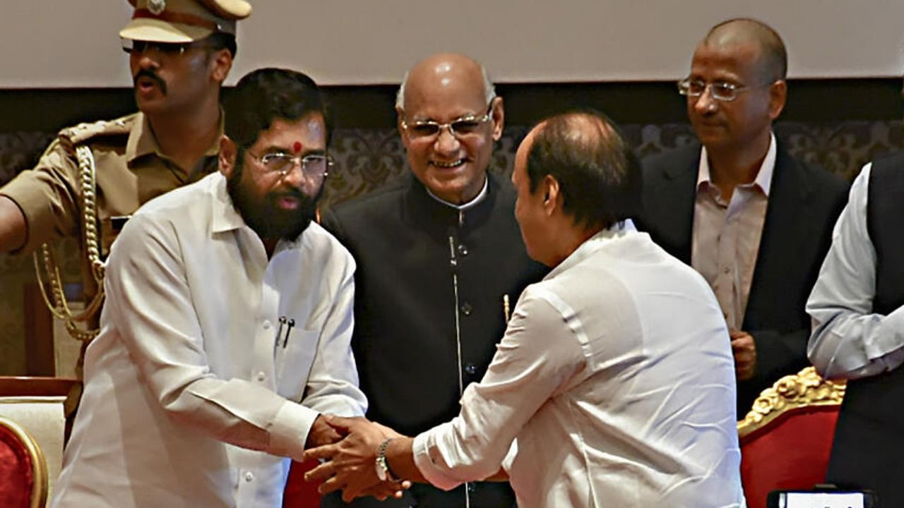 Maharashtra Chief Minister Eknath Shinde congratulates the newly sworn-in Deputy Chief Minister Ajit Pawar. Credit: PTI Photo