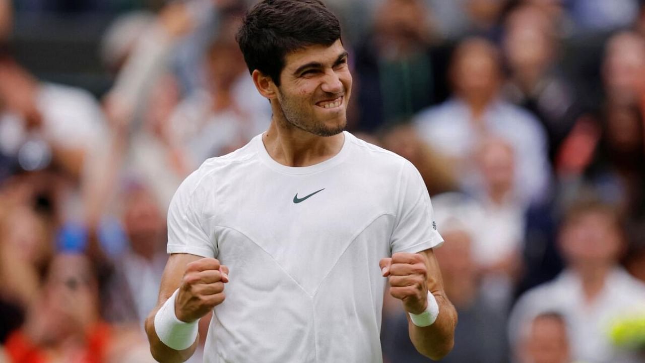 Alcaraz celebrates winning his 1st round match. Credit: Reuters Photo