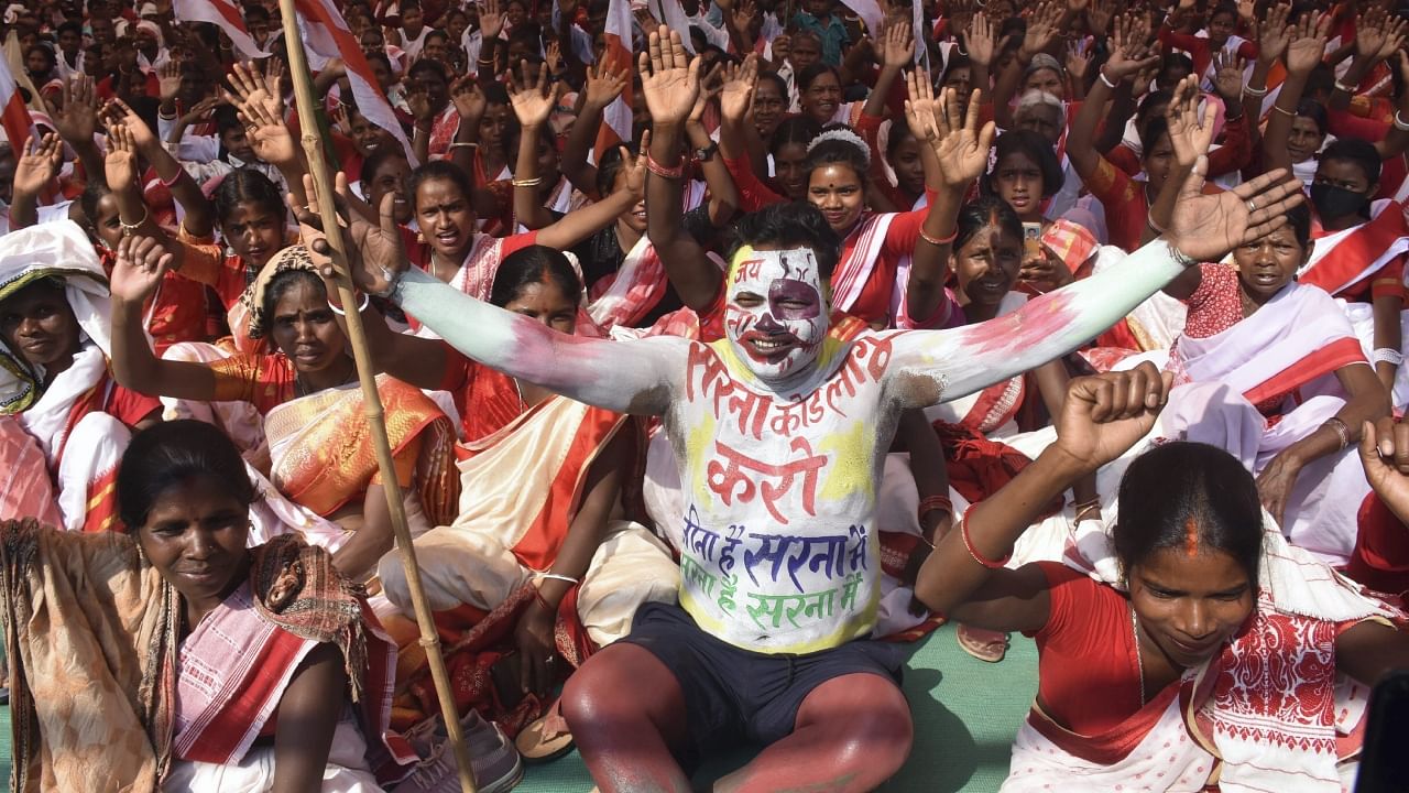 Tribals take part in a rally demanding a separate ‘Sarna Dharm Code’ for tribals, at Morhabadi grounds in Ranchi, Sunday, March 12, 2023. A separate 'Sarna' code in the census is the key to a distinct identity for tribals as without it, they are classified as Hindus or Muslims or Christians. Credit: PTI Photo